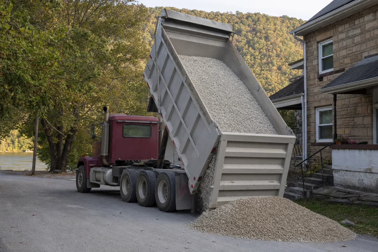 Dump truck delivering gravel